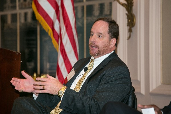 Cooley discusses the Navy's collaborative approach to addressing cybersecurity challenges at the October luncheon.
