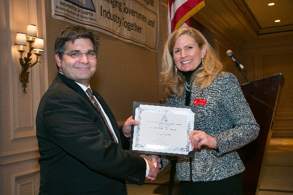 Newell (r) recognizes Clark as the AFCEAN of the Month for February.