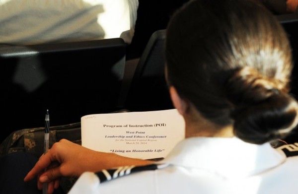 A West Point academy goes over the program for the 8th West Point Ethics and Leadership Conference in March.