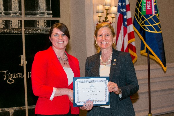 Sarah Greenert of General Dynamics Information Technology (l) accepts the May Young AFCEAN of the Month award from Newell.
