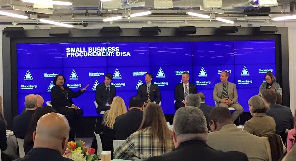 Members of the panel from (l-r) Sharon Jones; Daniel Snyder; Jeffrey Shen; Michael Devine; Douglas Packard; and Evelyn DePalma, moderator, address the crowd at the sold-out Small Business DISA Procurement Program in February.