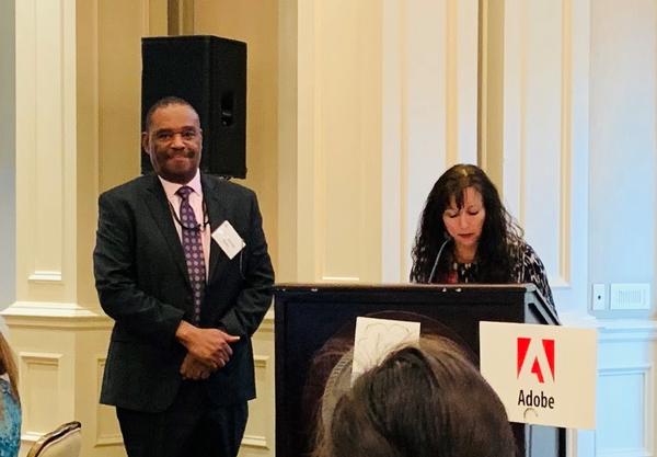Chapter President Dina Flynn presents Homer Betts, Phelps' Cisco Academy Instructor, with the STEM Teacher of the Quarter Award at the February luncheon.