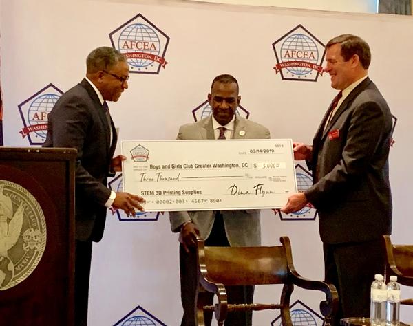 At the March luncheon, Fred Henry (l), chapter vice president of strategic initiatives and Anthony Robbins, chapter executive vice president (far r), present Jim Almond (c), regional vice president of the Boys and Girls Club of Greater Washington with a check for $3,000.