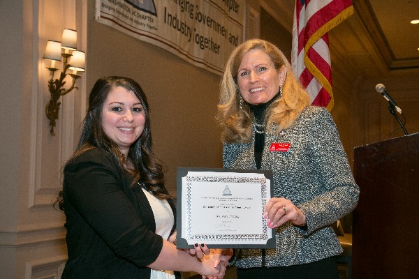 Newell (r) presents the Young AFCEAN of the Month award for February to Friesing.