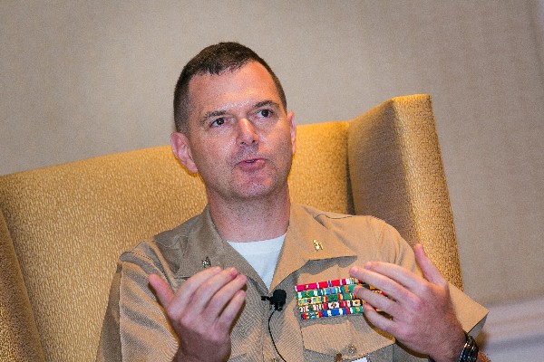 Col. Dave McMorries, USMC, commanding officer of the Marine Corps Network and Security Center, speaks on the May panel.
