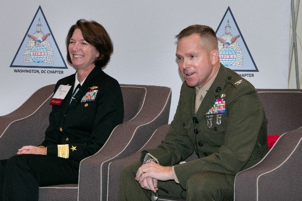 Rear Adm. Nancy Norton, USN, director of warfare integration for information dominance, and Col. Scott Stebbins, chief, C-4 Strategic Planning Division, C-4 Directorate, U.S. Marine Corps, discuss collaboration among the services at the October chapter breakfast.