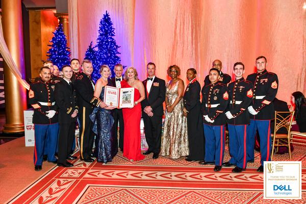 At the December event, members of the chapter leadership are presented with the Commander's Award from the U.S. Marine Corps Reserve. 