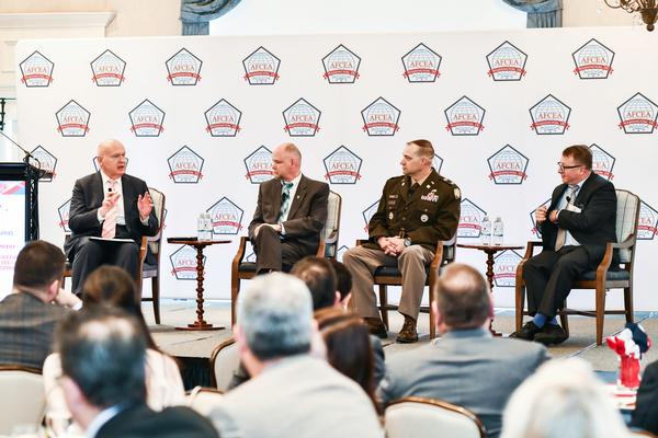 Moderator Francis Rose engages with panelists, Hurley, Strauss and Sasala.