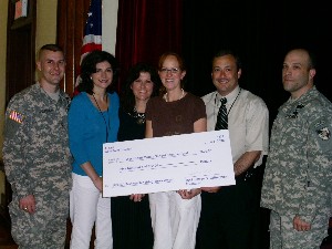 On June 5 at West Point Middle School, Maj. Jeffrey Gribschaw, USA (l), outgoing chapter treasurer, and Maj. A.J. Newtson, USA (r), incoming chapter treasurer, presented the science fund check to Tricia Willis (l-r), 7th and 8th grade teacher; Pam Granger, 6th grade teacher; Heather Zook, 7th grade teacher; and David Rudy, principal.