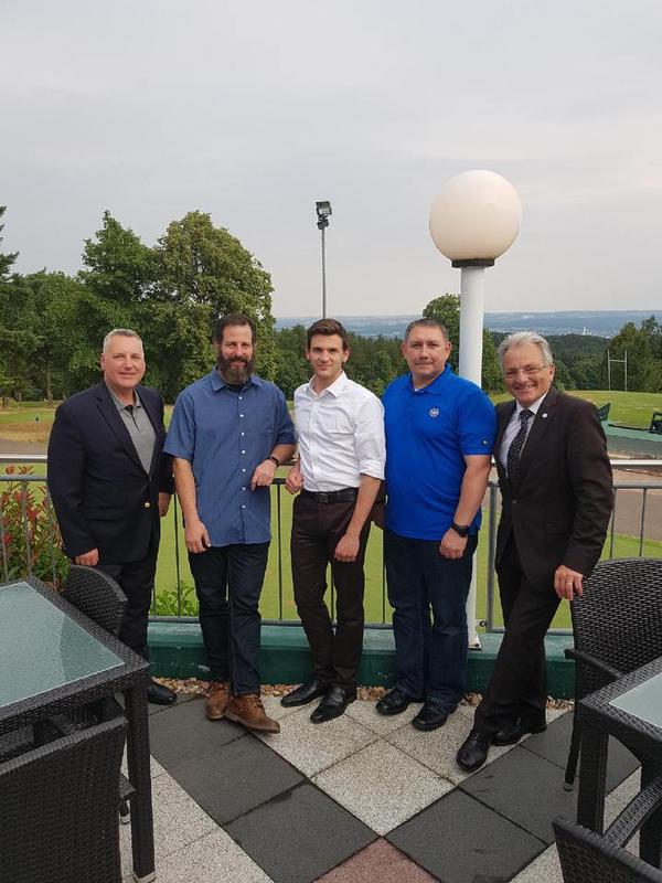 Maj. Gen. Erich Staudacher, GEAF (Ret.), general manager of AFCEA Europe (r), gathers with the chapter's newly elected officers, including David Pendall, president (l), at the membership kickoff event in July.