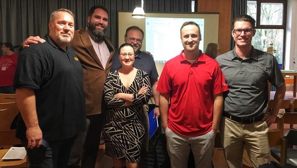 Serving as guest judges at the 10th Annual Department of Defense Education Activity STEMposium in December are (l-r) James Rink, Tom McMillon, Eric Sparks, Dawn Sverak and Marc Pritchard.
