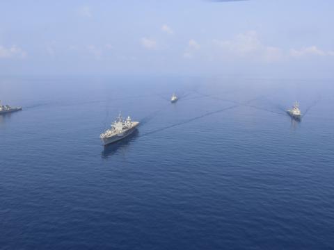 Securing waterways also requires civilians supporting the Navy's activities. Credit: Mass Communication Specialist 3rd Class Catie Coyle.