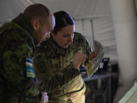 An intelligence operations officer works with an Estonian officer during Winter Strike 22 exercise in Poland. Credit: Spc. Charles Leitner, U.S. Army