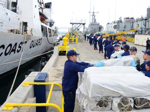 USCG and CBP partner to interdict 3,500 pounds of marijuana and over 30 pounds of methamphetamine from a boat in international waters 170 miles southwest of San Diego. U.S. Coast Guard photo by Petty Officer 3rd Class Connie Terrell. 2014. 