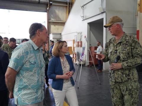 Deputy Secretary of Defense Kathleen Hicks, center, speaking with officials at Pearl Harbor Naval Shipyard in July, emphasized that the Department’s Microelectronics Commons effort to greatly scale domestic production of semiconductors was needed in order to face the threats from near-peer adversaries, such as China. Credit: Justice Vannatta, Pearl Harbor Naval Shipyard 