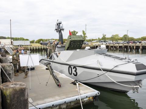 U.S. Marine Corps commanders reviewed the capabilities of the Long-Range Unmanned Surface Vessel in April 2023. This semiautonomous vessel is capable of extended trave and transporting loitering munitions. Credit: Sgt. Kealii De Los Santos, U.S. Marine Corps