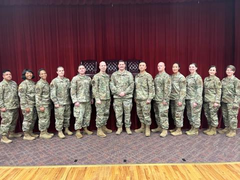 First sergeants from the 960th Cyberspace Wing pose with Chief Master Sgt. Christopher Howard, Command Chief of the 960th Cyberspace Wing, at Joint Base San Antonio-Lackland, Texas on March 27, 2023. The Air Force Reserve’s new Cyber Direct Commission program is a groundbreaking effort to bring more cyber warriors from industry and enlisted ranks into the Reserve. Air Force photo by 2nd Lt. Alex Dieguez