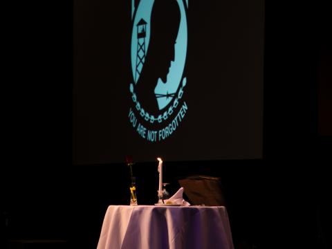 A table set for one at TechNet Indo-Pacific 2023 represents the prisoners of war and comrades missing in action. Credit: Artistic Mindz Photography. 