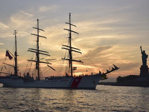 Coast Guard Cutter Eagle moors near the Statue of Liberty in New York, July 28, 2023, during a four-month training deployment for Coast Guard Academy cadets and officer candidates. Among other modernization efforts, the Coast Guard’s C5I Service Center is upgrading command and control systems both ashore and afloat. Credit: Navy Chief Petty Officer John Masson