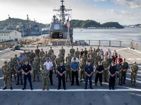 Senior military leaders from Australia, Canada, Japan, New Zealand, the United Kingdom and the United States stand together on the flight deck of the USS Blue Ridge (LCC-19), U.S. 7th Fleet, on September 12, 2023, during the 2023 Information Warfare Waterfront Conference in Yokosuka, Japan. The United States must increase its information warfare capabilities in a complex geopolitical environment. U.S. Navy Photo by Mass Communication Specialist 2nd Class Caitlin Flynn