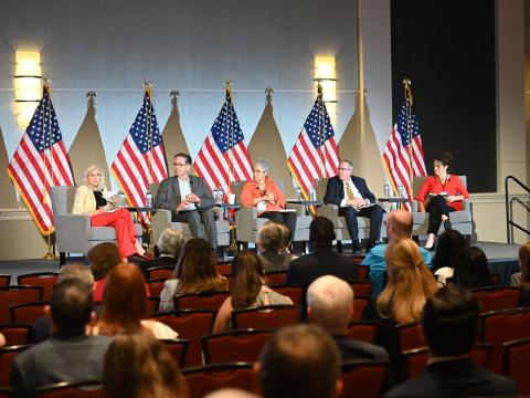 Scholars discuss the importance of encouraging creative thinkers to join the intelligence community at the 2024 Intelligence and National Security Summit in Bethesda, Maryland. Credit: Herman Farrer.