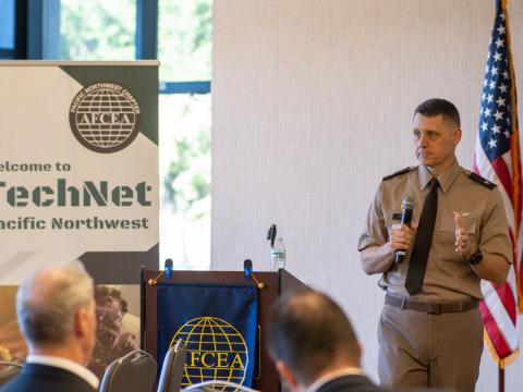Col. Tyler Oxley, chief information officer/G6, 94th Army Air and Missile Defense Command, addresses the audience at TechNet Pacific Northwest 2025 at Joint Base Lewis-McChord in Tacoma, Washington. Credit: Justin Manuel