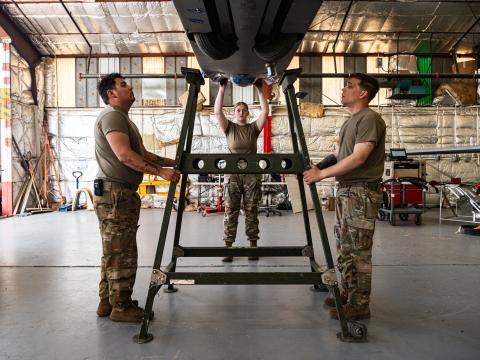 U.S. Army Spc. John De Los Santos (l), Spc. Kylie Chislow (middle) and Spc. Trevor Wagner (r), assigned to Foxtrot Company, 1st Aviation Regiment, 1st Combat Aviation Brigade, part of Joint Task Force - Southern Border, position a MQ-1 Gray Eagle onto a stand at Libby Airfield, Fort Huachuca, Arizona, May 13, 2025. Updated standards for avionics and space-related applications will increase interoperability and security. Credit: U.S. Army photo by Sgt. Chase Murray
