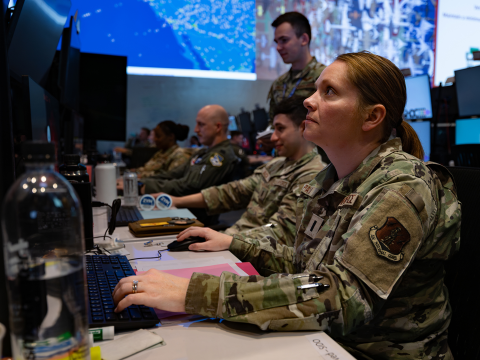 U.S. Air Force 1st Lt. Maurielle Pankau, a 183rd Air Component Operations Squadron intelligence analyst planner, participates in the Shadow Operations Center-Nellis Experiment 3 at Nellis Air Force Base, Nevada, June 13, 2025. (The image has been altered by blurring badges for security purposes and cropped to focus on the subject.) Credit: U.S. Air Force photo by Airman 1st Class Jennifer Nesbitt