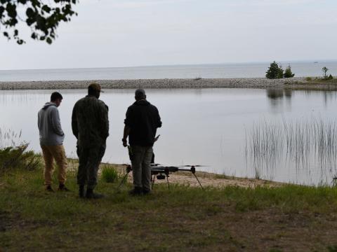 U.S. civilian contractors conduct tests of emerging electromagnetic advanced technology with Naval Surface Warfare Center Crane Division in Alpena, Michigan, during Exercise Silent Swarm, July 2023. Credit: U.S. Army National Guard photo by Maj. Megan Breen