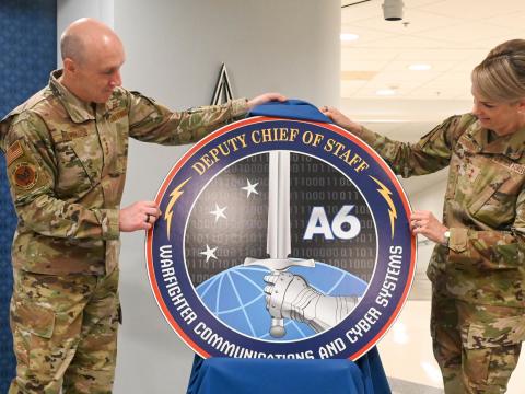 Air Force Chief of Staff Gen. David Allvin (l) and Maj. Gen. Michele Edmondson unveil the new logo for the new A6 office, the Air Force Deputy Chief of Staff Warfighter, Communications and Cyber Systems, at the Pentagon, Arlington, Virginia, July 23, 2025. According to the Air Force, the creation of the A6 office represents one of the most significant reorganizations of the Air Staff in more than 30 years. Credit: USAF photo by Staff Sgt. Stuart Bright