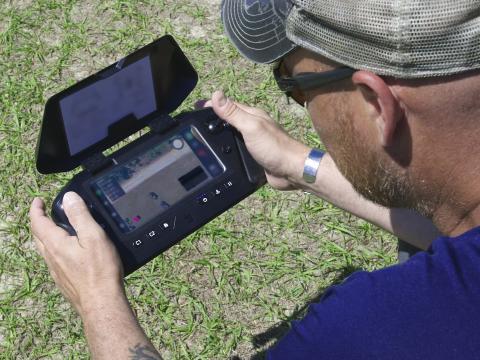 A member of the National Geospatial-Intelligence Agency’s Warfighter Support Office monitors the real-time data feed as the drone collects data over the Army’s training setup, as part of testing a prototype capability known as the GEOINT AI/ML Based Light-Edge Resilient system, or GAMBLER, during training at Fort Bragg, North Carolina. Credit: Courtesy photo