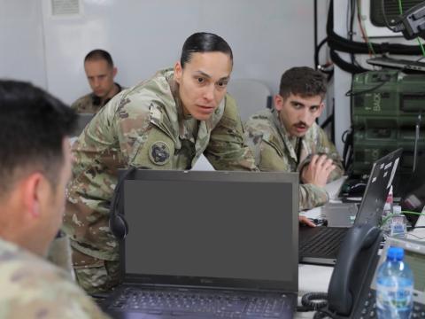 U.S. Army Sgt. 1st Class Maria Devers (c), assigned to Headquarters and Headquarters Battalion, 4th Infantry Division, and U.S. Army Spc. Jaeger Falco, assigned to the Utah National Guard’s 4th Infantry Division Main Command Post Operational Detachment, both Ground Movement Target Indicator (GMTI) operators, coordinate a simulated ground attack during a multi-domain and multinational operations command post exercise in Boleslawiec, Poland, in June 2023. Credit: U.S. Army photo by Sgt. 1st Class Bridget Vian
