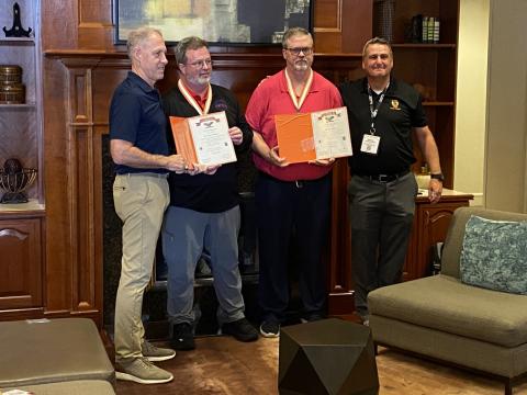 AFCEA's Terry Rogers and Ben Smith receive the Brevet Colonel award from the Signal Corps Regimental Association on August 18, 2025, at TechNet Augusta. 