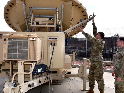 Spc. Klay Walker and Spc. Alexander Best with the 4th Space Company, 1st Space Battalion, work on a Mobile Integrated Ground Suite at Fort Carson, Colorado. U.S. Army Photo by Dottie White