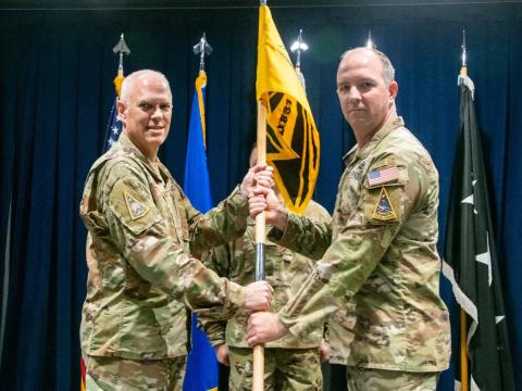 Col. Neil Barnas (r), USSF, assumes command of Systems Delta 831 (SYD 831) on October 2, at Los Angeles Air Force Base, as Lt. Gen. Phil Garrant, USSF, Space Systems Commander presides over the ceremony.