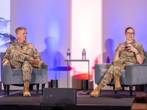 Brig. Gen. Jeffrey Phillips, USAF, and Brig. Gen. (select) Lauren Courchaine, USAF, engage in a fireside chat on February 5, 2026, at the Rocky Mountain Cyberspace Symposium 2026. Credit: Zach Watkins, LVTD Digital