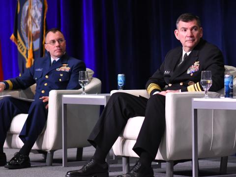 Rear Adm. Matthew Lake, USCG (left), and Vice Adm. Brad Skillman, USN (right), listen during a panel at WEST 2026 held in San Diego. Credit: Karras Photography