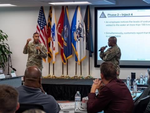Maryland Army National Guard Col. Louis Patrick Hawkins Jr., and Maryland Air National Guard Lt. Col. Michael S. Graham Jr., lead Maryland National Guardsmen and civilian security and infrastructure cybersecurity experts in a tabletop exercise during the third day of the State of Maryland Critical Infrastructure Cyber Resilience Workshop.  U.S. Air National Guard Photo by Airman 1st Class Sarah Hoover