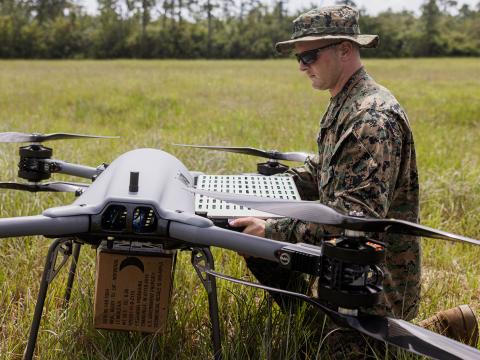 U.S. Marine Corps Lance Cpl. Quinn Stillman, a small unmanned aerial system operator with Combat Logistics Regiment 2, 2nd Marine Logistics Group, changes the battery on a TRV150 unmanned aerial system during a tactical demonstration. With the Lift Challenge, the Defense Advanced Research Projects Agency intends to dramatically increase small drone payload capabilities. Lance Cpl. Hunter Kuester/U.S. Marine Corps