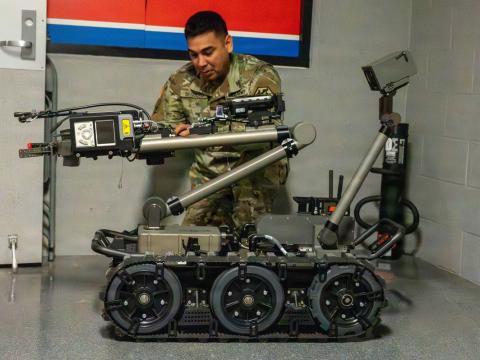 Master Sgt. Rolando Silguero, noncommissioned officer in charge at the Chemical Defense Training Facility, prepares a man transportable robotic system to perform site exploration in February at Fort Leonard Wood. Credit: U.S. Army photo by Melissa Buckley