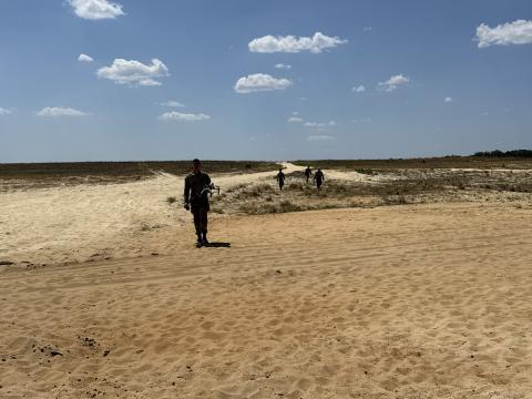 Soldiers from the 82nd Airborne Division recover downed drones during an operational assessment at Ft. Bragg’s Salerno Drop Zone on April 24. Credit: Kimberly Underwood 