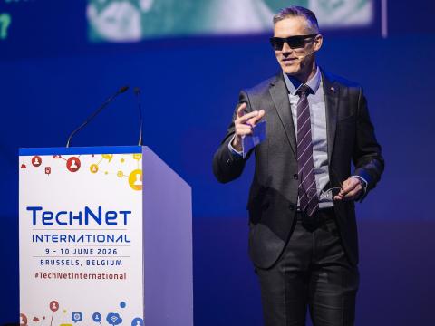Digital policy adviser at the U.S. Mission to NATO channels Mr. Anderson from "The Matrix" at TechNet International 2026, using the movie's red pill moment as an analogy for NATO's digital wake-up call. Credit: Matthieu Labey Photographer