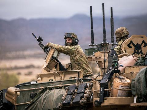 Spc. Hayzin Zappanti, an armor crewmember assigned to Bravo Company, 1st Battalion, 66th Armor Regiment, 3rd Armored Brigade Combat Team, 4th Infantry Division, provides security during Ivy Mass on Fort Carson, Colorado, May 5, 2026. Ivy Mass validated large-scale combat operations while integrating Next Generation Command and Control capabilities to enhance situational awareness, data sharing, and decision-making across the formation. Credit: U.S. Army photo by Spc. Thomas Nguyen