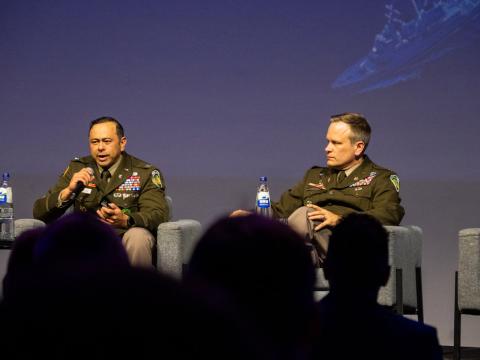 Col. Arnel David (l) and Lt. Col. Ash Lubecke discuss NATO’s Maven Smart System in Brussels. Credit: Infodos