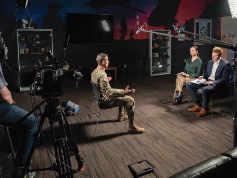 SIGNAL Media reporters Nuray Taylor and Evan Lynch interview Lt. Gen. Paul Stanton, USA, director of the Defense Information Systems Agency and commander of the Department of War Cyber Defense Command, in April. Credit: Edward Cannon, DISA Photographer