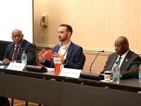 Gabriele Chiulli (c), acting CIO for the U.S. Army, and Kenneth McNeill (r), CIO at the National Guard Bureau, speak on standardization and data centricity at TechNet Augusta on August 19, 2026. Credit: Hillary Kay Studios