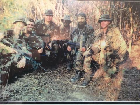 Long-range surveillance team in operational concealment during field training, early 1990s. The unit was a Texas Army National Guard long-range surveillance company operating under the 143rd Infantry lineage (formerly long-range reconnaissance patrol). Credit: Photo from author’s collection