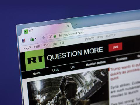 RT, an international television network funded by the Russian government, encourages viewers to be skeptical about the information they read. Credit: Sharaf Maksumov/Shutterstock.com