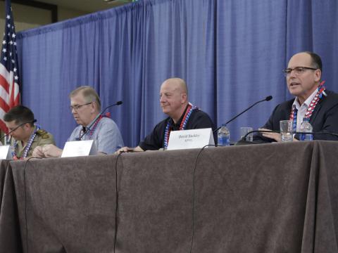 Officials from four nations address issues confronting efforts to achieve coalition interoperability. Credit: Bob Goodwin Photography