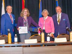 Director of Diversity Susan Emert, second from left, receives the inaugural Women in Maritime IT Award from the Hampton Roads Chapter. 